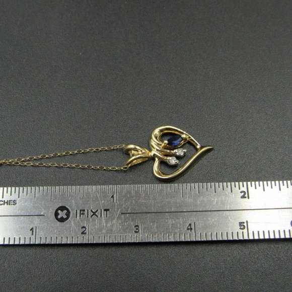16" 10K Gold White & Blue Topaz Heart Necklace